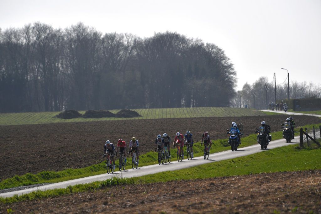 WAREGEM BELGIUM MARCH 31 Florian Senechal of France and Team Deceuninck QuickStep Warren Barguil of France and Team Arka Samsic Jasper Stuyven of Belgium and Team Trek Segafredo Greg Van Avermaet of Belgium and Team AG2R Citren Team Giacomo Nizzolo of Italy and Team Qhubeka Assos Luke Durbridge of Australia and Team BikeExchange Christophe Laporte of France and Team Cofidis during the 75th Dwars Door Vlaanderen 2021 Mens Elite a 1841km race from Roeselare to Waregem Breakaway Landscape DDV DDV21 FlandersClassic A travers la Flandre on March 31 2021 in Waregem Belgium Photo by Luc ClaessenGetty Images