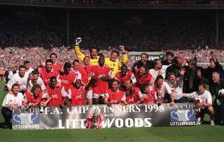 The Arsenal team celebrate after the FA Cup final against Newcastle United at Wembley Stadium in London. Arsenal won the match 2-0.
