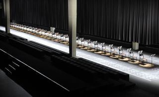 Fashion runway with a row of seats in the centre for musicians