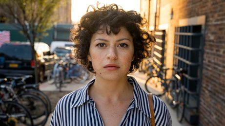 Dory (Alia Shawkat) looks down the lens in a promotional still for HBO Max's "Search Party"