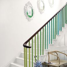white staircase with wall pictures