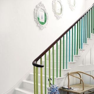 white staircase with wall pictures