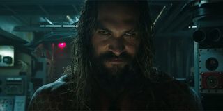 Aquaman smiling as he enters the submarine