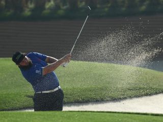 Andrew Johnston blasts out of the sand
