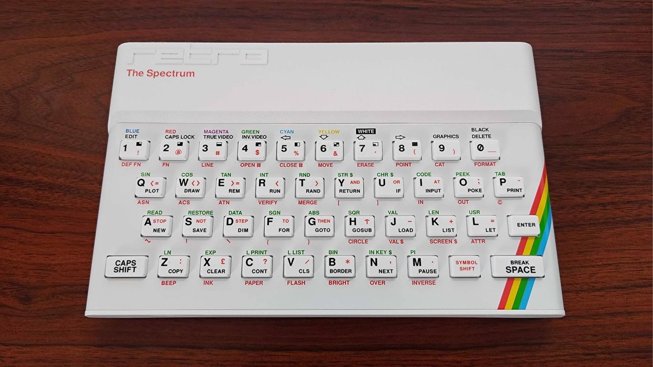 The Spectrum White Edition on woodgrain desk.