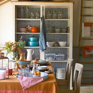 kitchen with open crockery shelf and table