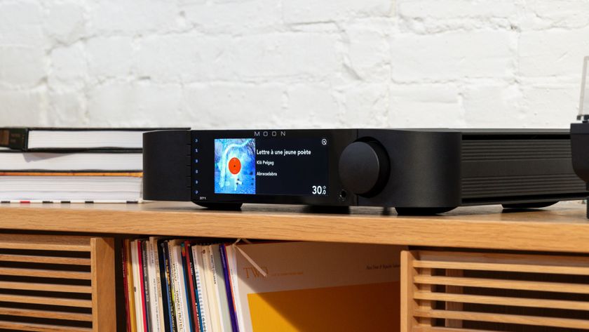 Moon 371 streaming amp on wooden cabinet in lifestyle setting