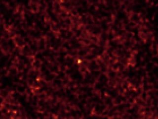 This image of asteroid 2011 MD was taken by NASA's Spitzer Space Telescope in Feb. 2014, over a period of 20 hours. The long observation, taken in infrared light, was needed to pick up the faint signature of the small asteroid (center of frame).
