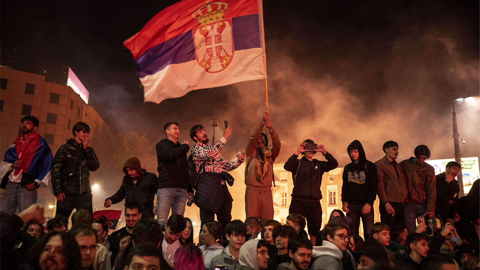 Supporters of the opposition Student List party celebrate the defeat of Aleksandar Vučić in Serbia