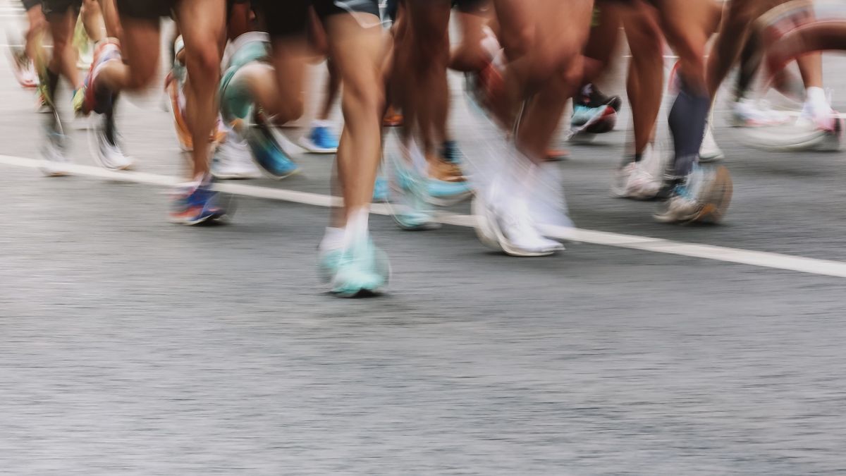 Close-up of runners&#039; feet during a race