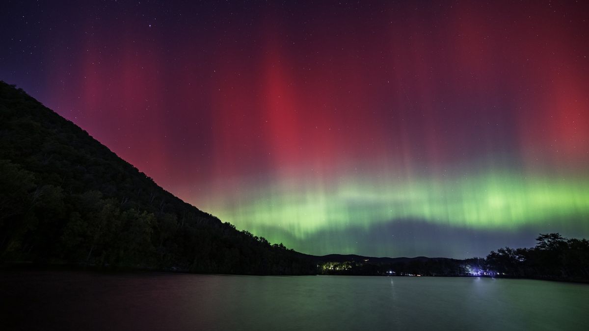 Aurora Borealis Lights Up New York,Bear Mountain,New York,United States,USA. Ribbons of green and red light fill the sky.