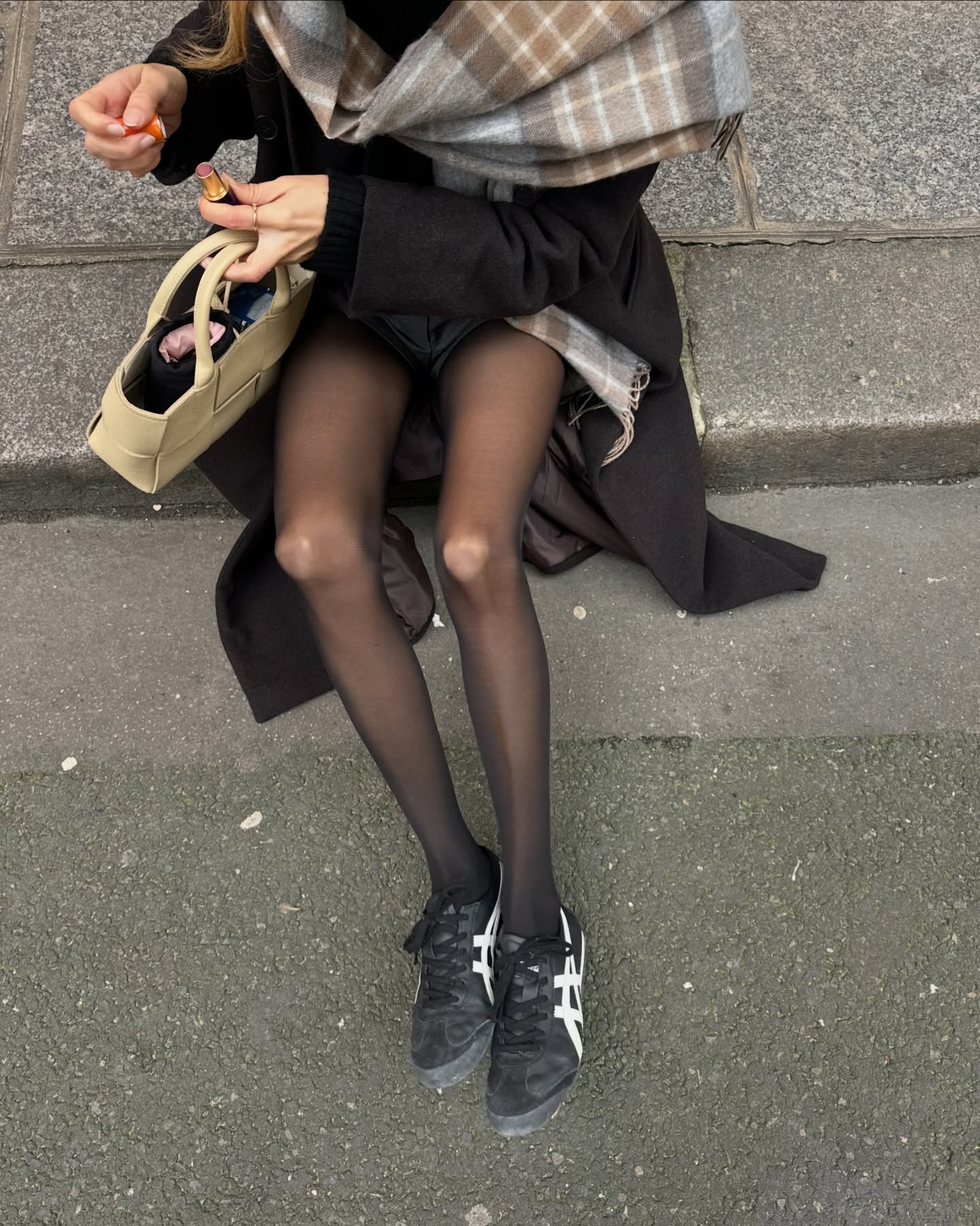 Influencer wearing sneakers with sheer tights