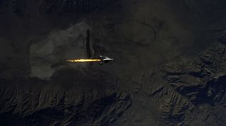 SpaceShipTwo ignites her hybrid rocket motor, as seen from WhiteKnightTwo. During the Jan. 10, 2014, test flight, the rocket motor fired for 20 seconds, accelerating SpaceShipTwo to Mach 1.4, and carrying the vehicle to an altitude of 71,000 feet over Mojave Air & Space Port.