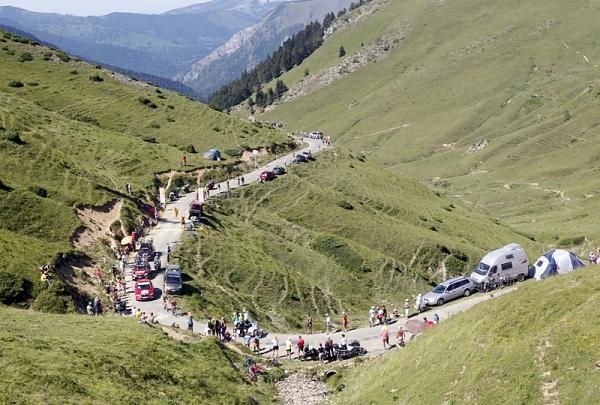 The peloton winds its way up the mountains