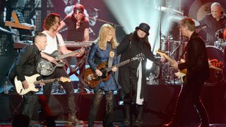 Mike McCready, Chris Cornell, Nancy and Ann Wilson and Jerry Cantrell play guitar onstage at 2013 Rock and Roll Hall of Fame ceremony