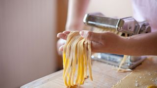 Best pasta makers 2022: image of fresh pasta in machine
