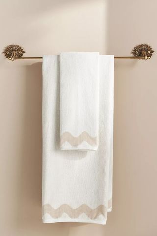 White bath towel with beige scalloped pattern detail