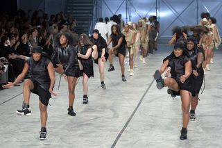 Models dance as they present creations by Rick Owens during the 2014 Spring/Summer ready-to-wear collection fashion show