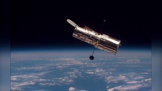 NASA's Hubble Space Telescope shown above Earth.