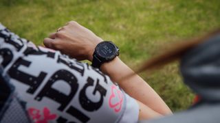 Female cyclist wearing a smartwatch