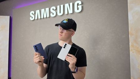 Hamish holding the Samsung Galaxy Z Fold 8 Ultra next to the Fold 7