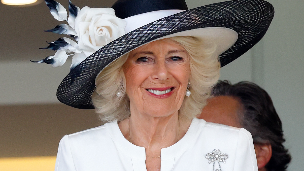 Queen Camilla watches the racing from the Royal Box as she attends day five of Royal Ascot at Ascot Racecourse on June 21, 2025