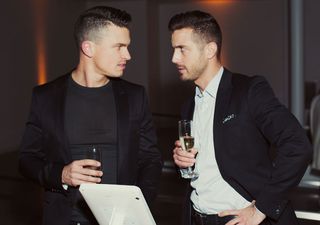 Two male guests explore the iPad edition of our Design Awards issue