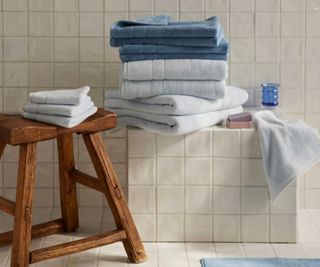 Brooklinen Super Plush Bath Towels in a tiled bathroom.