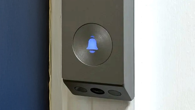 EZVIZ EP3x Pro video doorbell mounted beside blue door