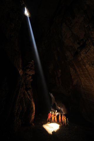 A shaft of sunlight shines on a past CAVES (Cooperative Adventure for Valuing and Exercising human behaviour and performance Skills) expedition underground in Sardinia, Italy.