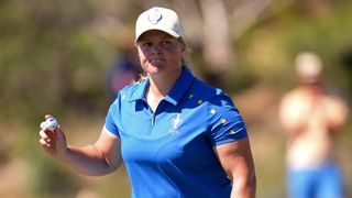 Caroline Hedwall with her ball after a putt at the 2023 Solheim Cup