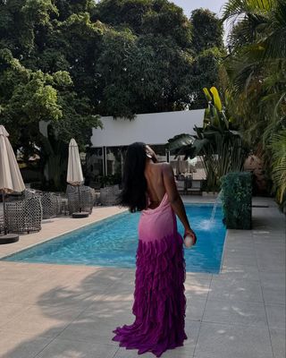 Best wedding guest dresses: Influencer in a backless dress