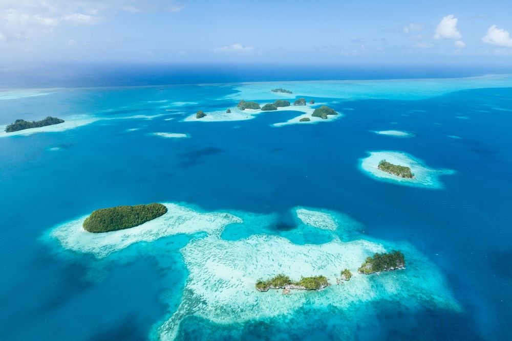 Aerial view of tropical paradise islands, coral reef and clear blue water, Palau, Micronesia