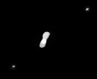 An image showing the asteroid Kleopatra and its two small moons, AlexHelios and CleoSelene, based on data gathered in July 2017.