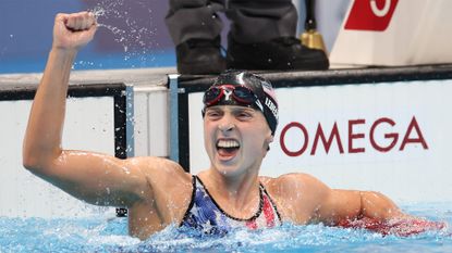 The USA's Katie Ledecky celebrates winning the women's 1500m freestyle gold medal at Tokyo 2020.