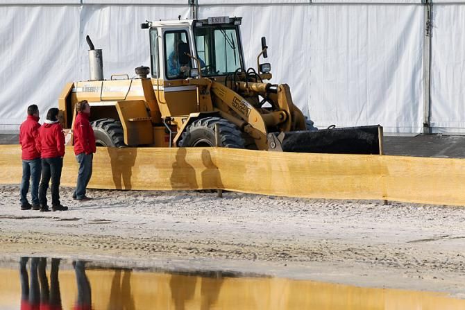 Some serious earth-moving equipment in use to set up the Belgian 'cross championship circuit.