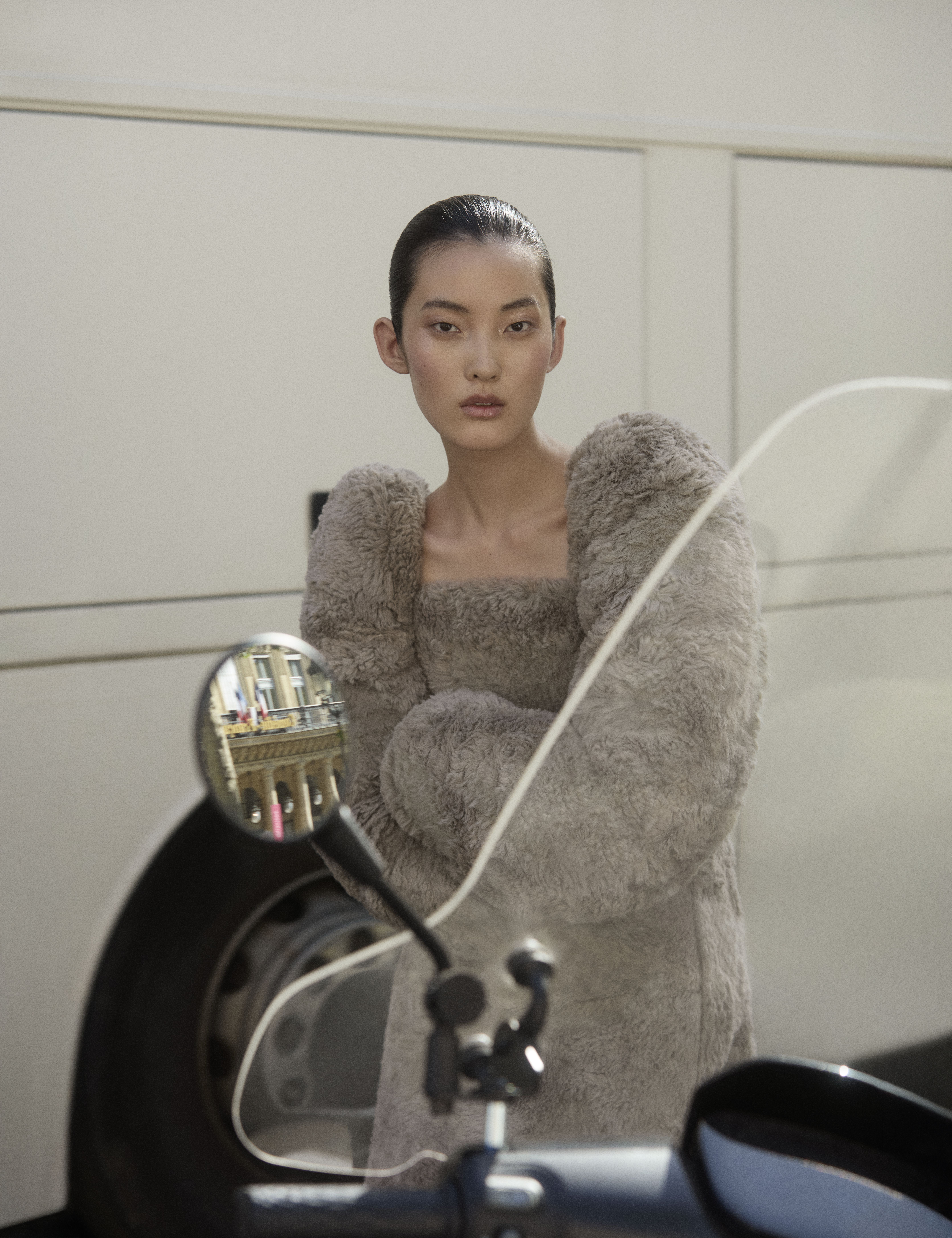 a model on the streets of paris wearing designs from the autumn/winter 2025 collections