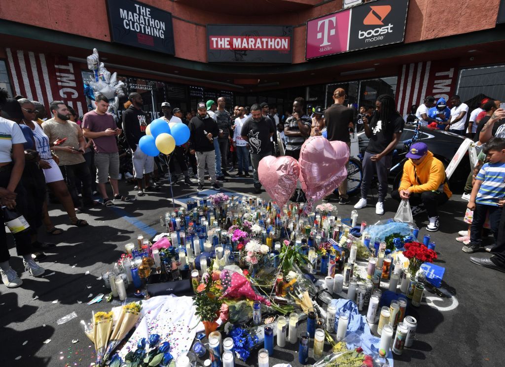 Mourners gather outside Nipsey Hussle&amp;#039;s clothing store in Los Angeles.