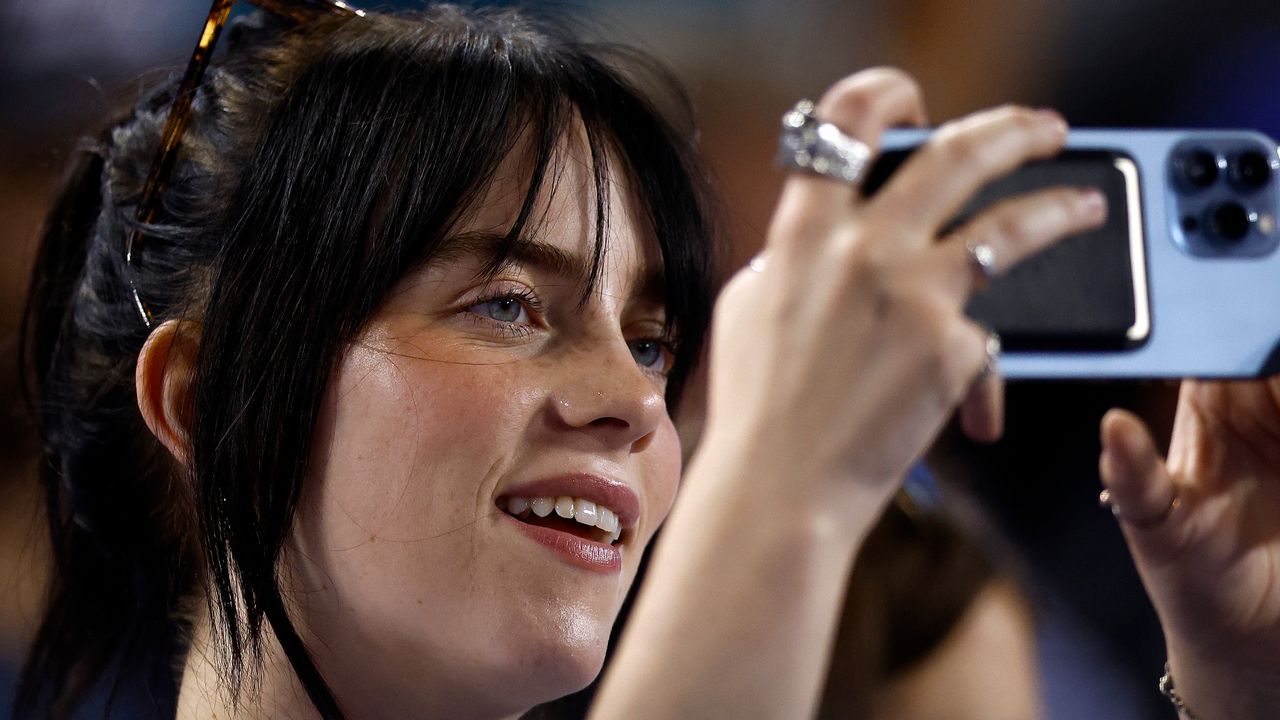 “It’s an important part of the culture that we are all on our goddamn phones and it keeps us connected, you know?”: Billie Eilish doesn’t have a problem with phones at gigs
