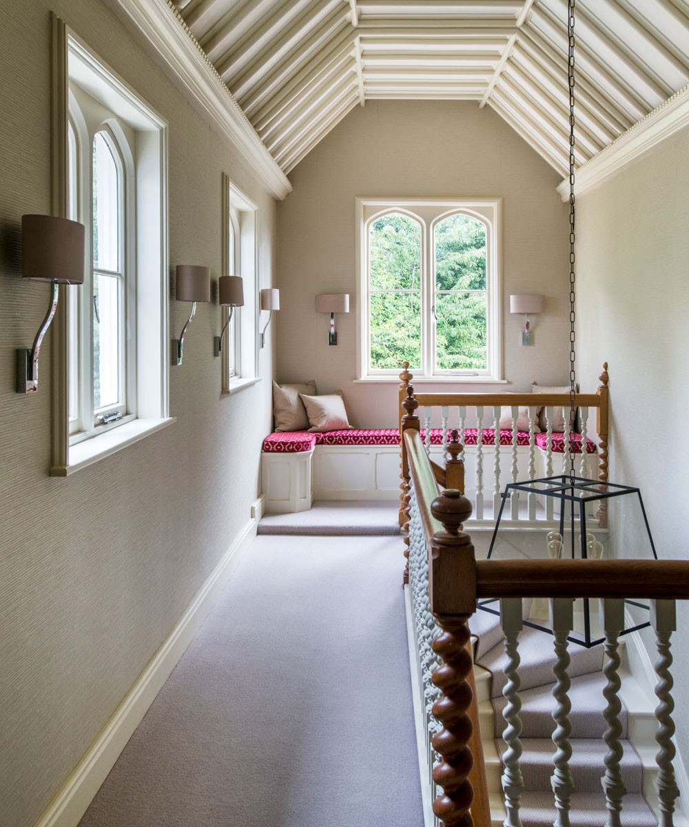 landing with staircase and white windows