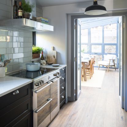 view through from a kitchen into a conservatory dining area