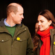 Britain's Prince William, Duke of Cambridge, and Britain's Catherine, Duchess of Cambridge, react during their visit to Pant Farm, a goat farm that has been providing milk to a local cheese producer for nearly 20 years, near Abergavenny, south Wales