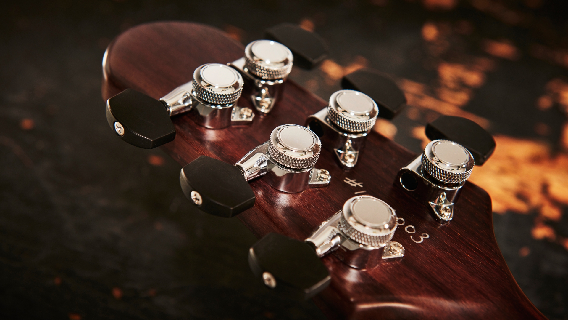 Close up of the tuning machines on an electric guitar