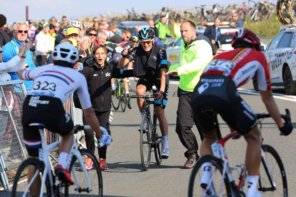 Wout Poels tells his teammates he's won