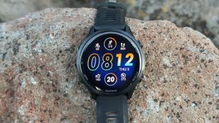The Garmin Forerunner 970 showing a watch face with data like Training Readiness, Intensity Minutes, Training Load, and Steps.
