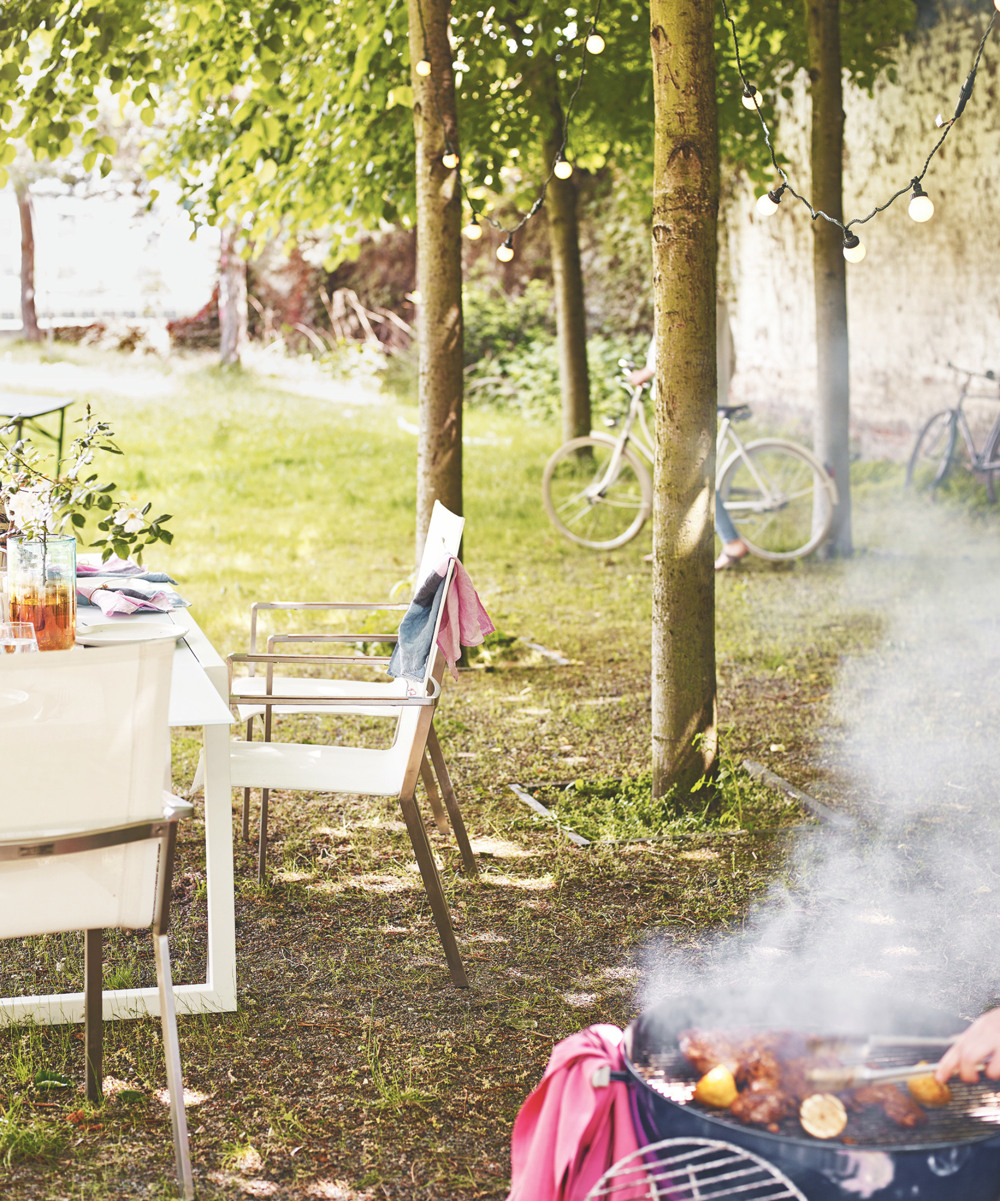 grassy area with table and barbecue