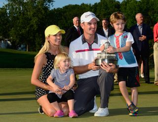 Justin and his family after victory at the 2014 Quicken Loans