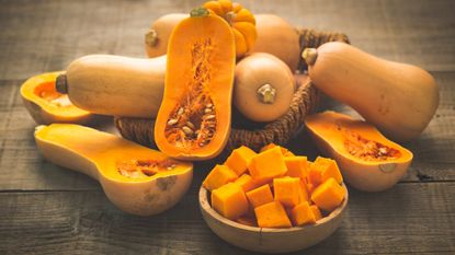 Whole, halved, and cubed butternut squashes