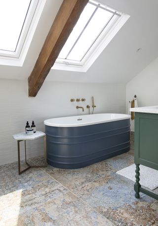 blue skirted bath in attic bathroom