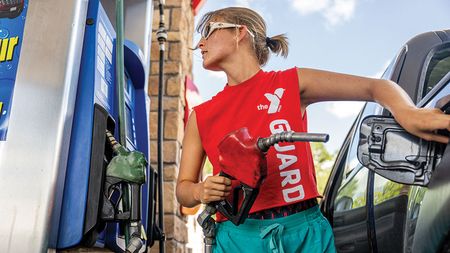 An American person filling their car up with petrol